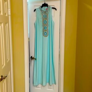 Light blue sleeveless dress with detailed beads down the front.